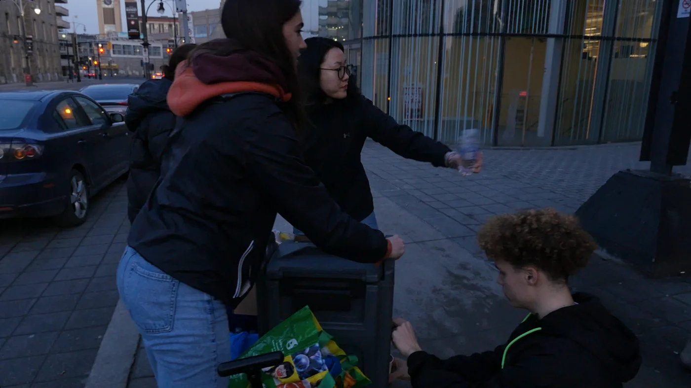 Handing out water to people downtown
